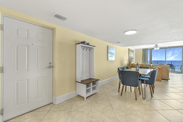 dining room with visible vents, baseboards, and light tile patterned flooring