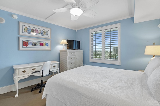 bedroom featuring a ceiling fan, baseboards, ornamental molding, and carpet flooring