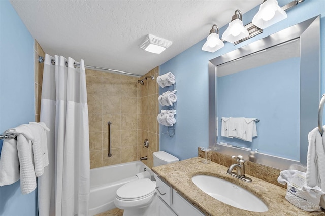 full bath featuring shower / tub combo with curtain, a textured ceiling, toilet, and vanity