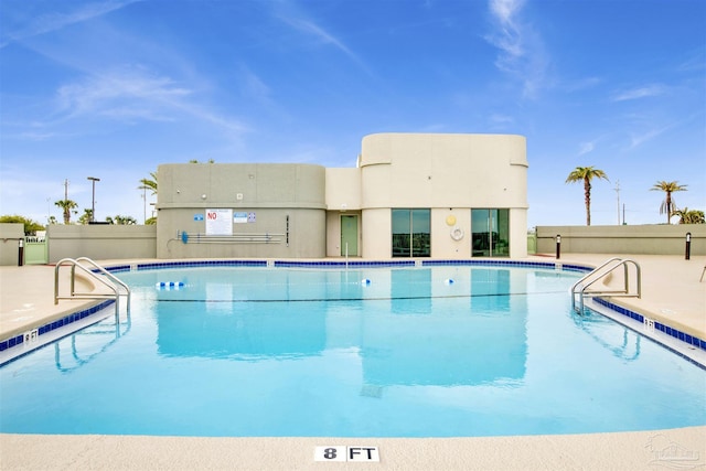 community pool with fence