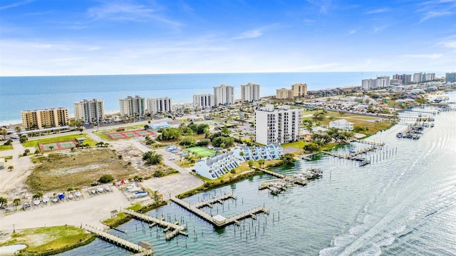 drone / aerial view featuring a water view and a city view