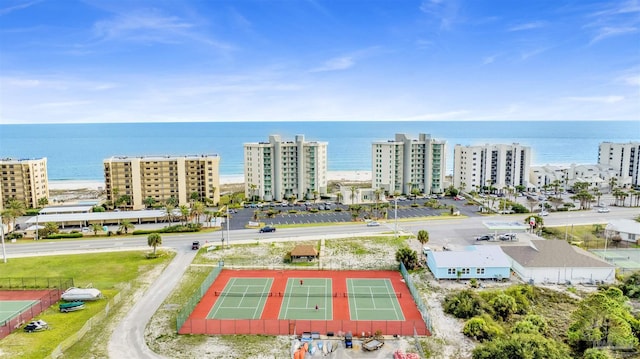 birds eye view of property with a view of city and a water view