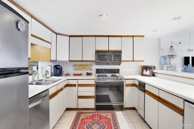 kitchen with stainless steel appliances and white cabinets