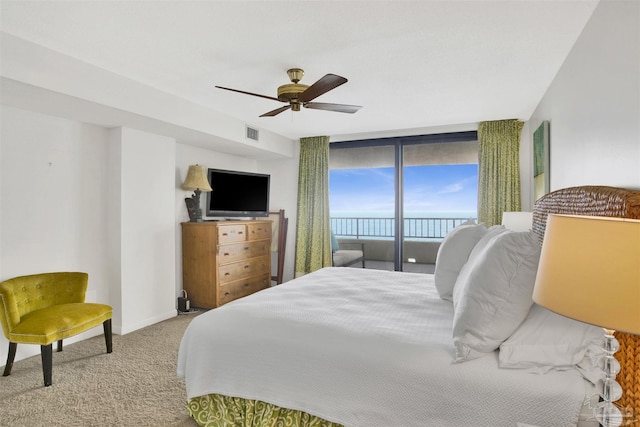 bedroom featuring ceiling fan, light colored carpet, and access to outside