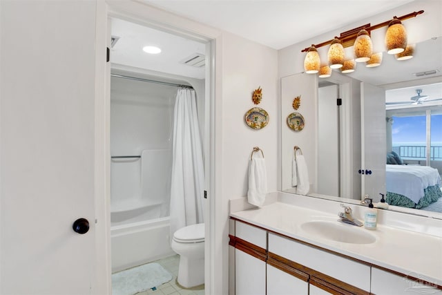 full bathroom featuring toilet, vanity, shower / bath combo, ceiling fan, and tile patterned flooring