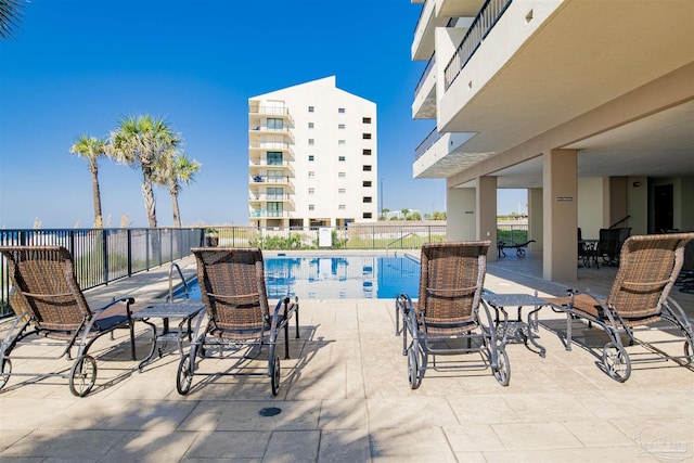 view of patio featuring a community pool