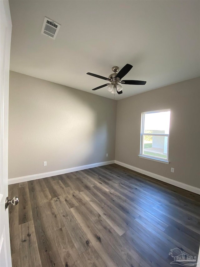 unfurnished room featuring ceiling fan and dark hardwood / wood-style flooring