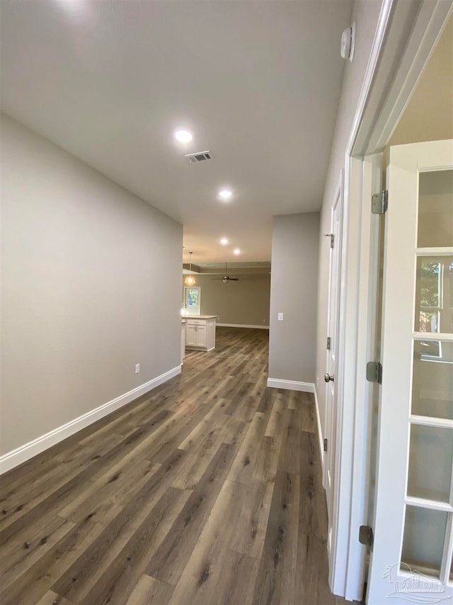 empty room with dark hardwood / wood-style floors