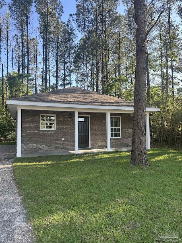 10 Middleton Ln, Atmore, AL 36502 - view of front facade with brick siding and a front lawn