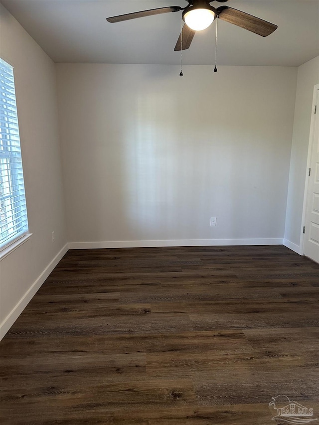 10 Middleton Ln, Atmore, AL 36502 - empty room with dark wood-type flooring, baseboards, and a ceiling fan