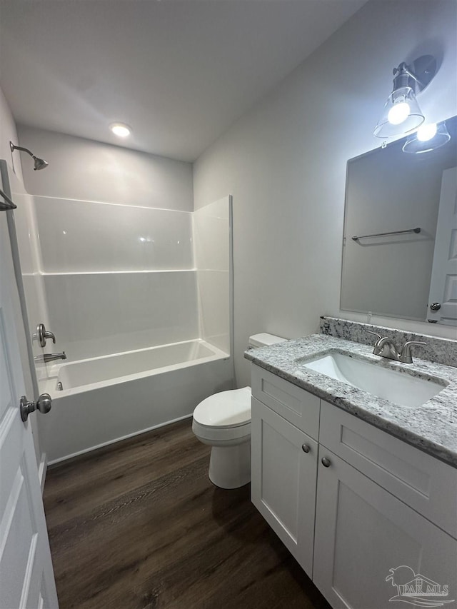 10 Middleton Ln, Atmore, AL 36502 - bathroom featuring shower / bath combination, vanity, toilet, and wood finished floors