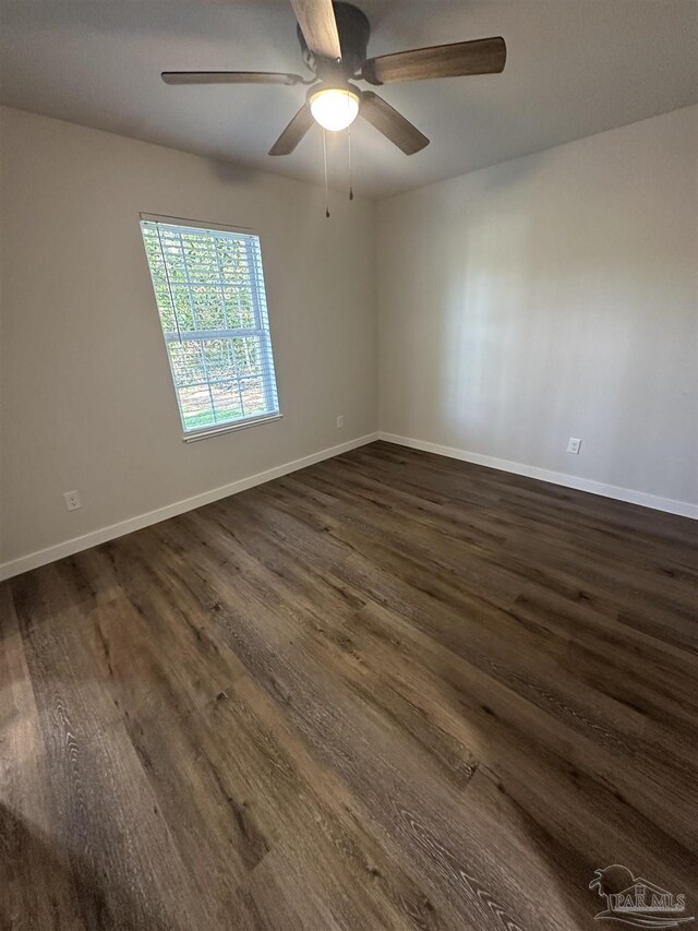 10 Middleton Ln, Atmore, AL 36502 - empty room featuring dark wood-style flooring, ceiling fan, and baseboards