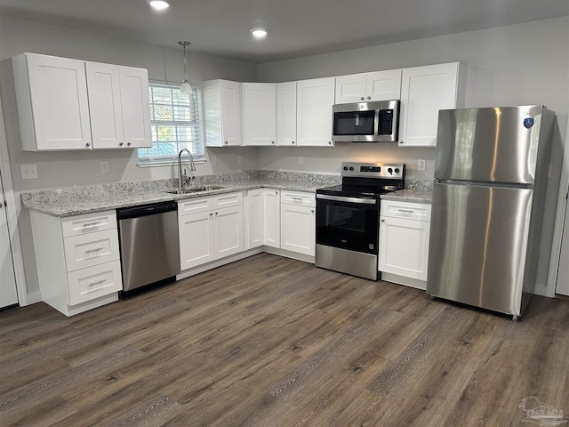 10 Middleton Ln, Atmore, AL 36502 - kitchen featuring stainless steel appliances, recessed lighting, white cabinetry, and a sink