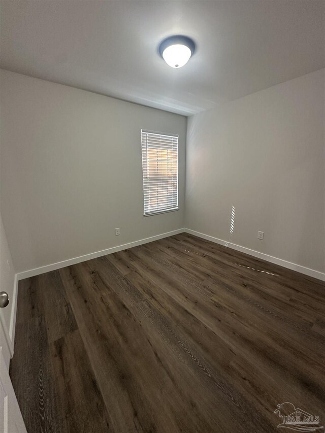10 Middleton Ln, Atmore, AL 36502 - unfurnished room featuring dark wood-type flooring and baseboards