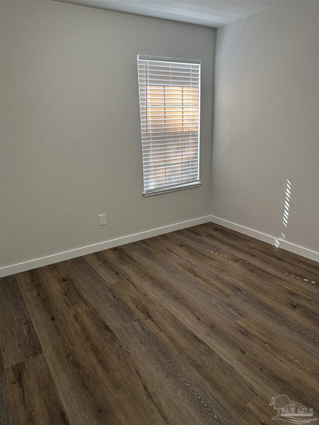 10 Middleton Ln, Atmore, AL 36502 - unfurnished room with dark wood-style flooring and baseboards