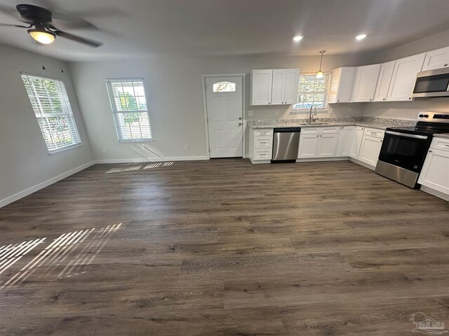 10 Middleton Ln, Atmore, AL 36502 - kitchen with recessed lighting, a sink, white cabinets, and stainless steel appliances
