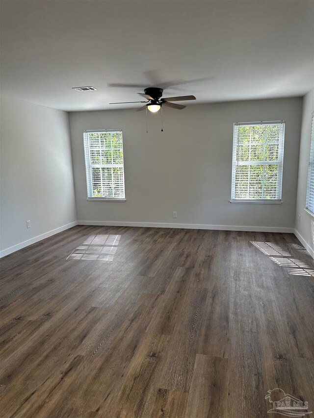 10 Middleton Ln, Atmore, AL 36502 - empty room featuring dark wood-style floors, baseboards, a ceiling fan, and visible vents