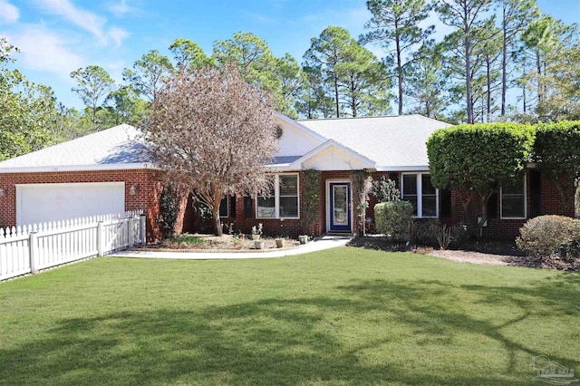 ranch-style house with brick siding, a front yard, and fence