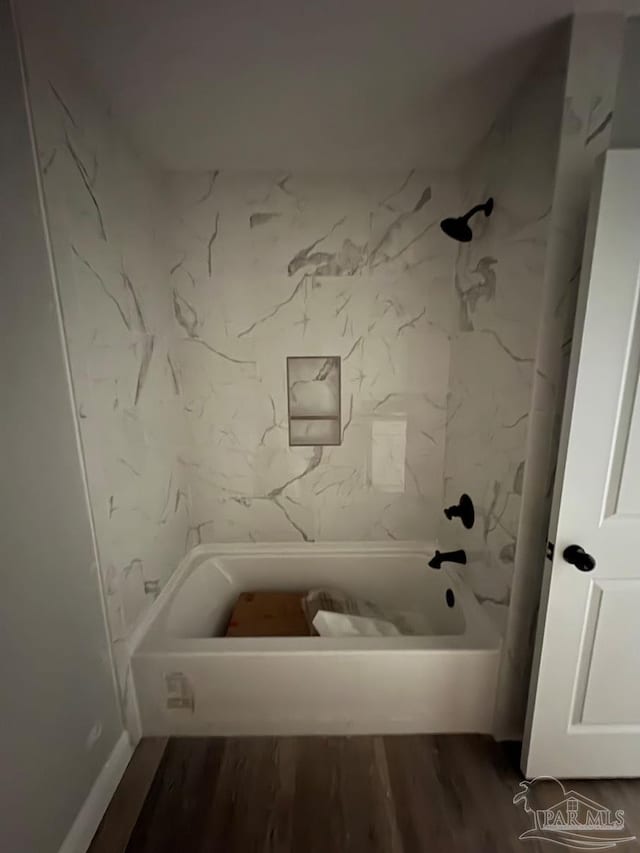 7147 Heath Rd, Milton, FL 32570 - full bathroom with shower / tub combination and wood finished floors
