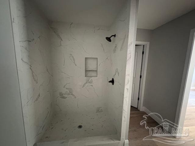 7147 Heath Rd, Milton, FL 32570 - full bath with a marble finish shower and wood finished floors