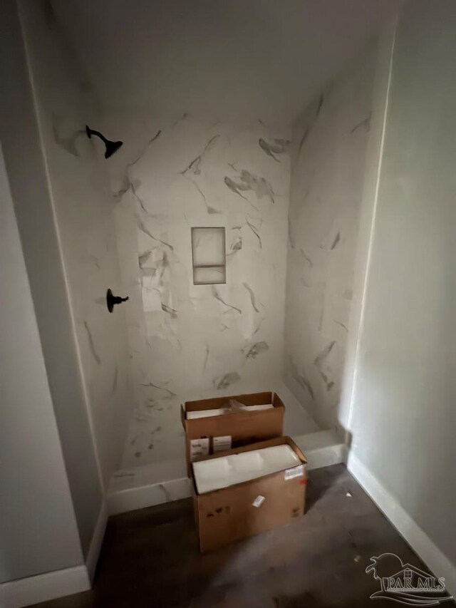 7147 Heath Rd, Milton, FL 32570 - bathroom featuring a marble finish shower and baseboards