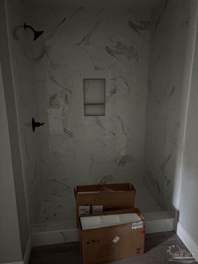 7147 Heath Rd, Milton, FL 32570 - bathroom featuring a marble finish shower and baseboards