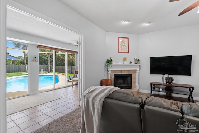 3849 Saber Tooth Cir, Gulf Breeze, FL 32563 - tiled living area featuring a ceiling fan and a fireplace