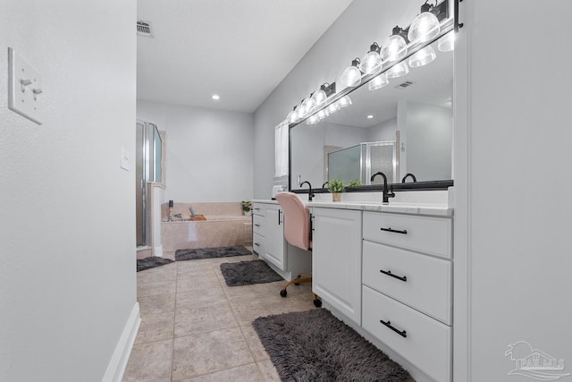 3849 Saber Tooth Cir, Gulf Breeze, FL 32563 - bathroom with vanity, a shower stall, a bath, tile patterned flooring, and recessed lighting