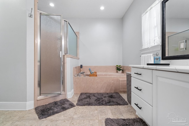 3849 Saber Tooth Cir, Gulf Breeze, FL 32563 - bathroom featuring vanity, a stall shower, a garden tub, recessed lighting, and tile patterned floors
