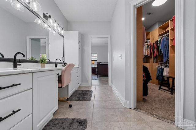 3849 Saber Tooth Cir, Gulf Breeze, FL 32563 - full bathroom featuring double vanity, tile patterned floors, and a spacious closet