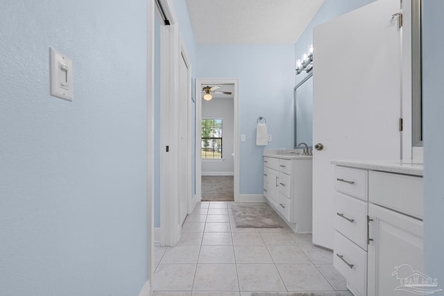 3849 Saber Tooth Cir, Gulf Breeze, FL 32563 - full bath featuring two vanities, a ceiling fan, and tile patterned floors