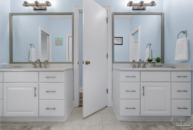 3849 Saber Tooth Cir, Gulf Breeze, FL 32563 - full bathroom with two vanities and tile patterned flooring