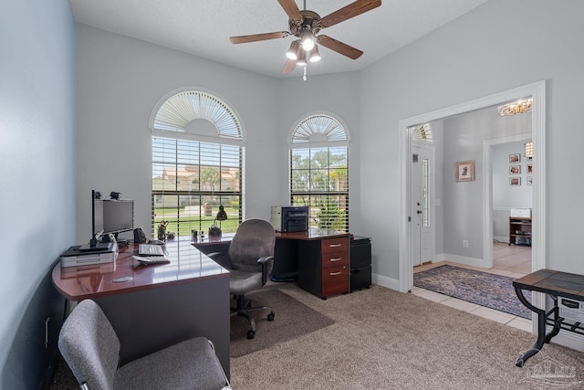 3849 Saber Tooth Cir, Gulf Breeze, FL 32563 - carpeted office space featuring ceiling fan, tile patterned floors, and a chandelier