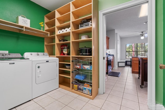3849 Saber Tooth Cir, Gulf Breeze, FL 32563 - laundry area with washer and clothes dryer, light tile patterned floors, and ceiling fan