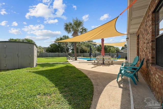 3849 Saber Tooth Cir, Gulf Breeze, FL 32563 - fenced backyard featuring a storage shed and a patio