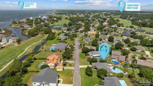 3849 Saber Tooth Cir, Gulf Breeze, FL 32563 - aerial view of property and surrounding area with a large body of water and nearby suburban area