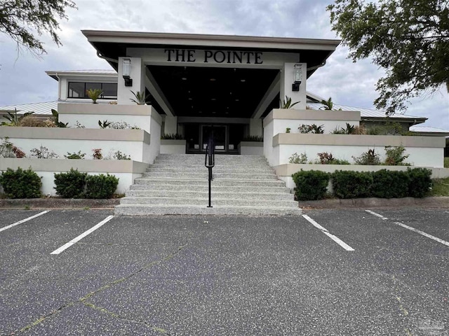 3849 Saber Tooth Cir, Gulf Breeze, FL 32563 - view of property featuring stairs and uncovered parking