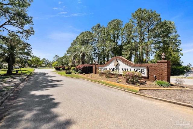 3849 Saber Tooth Cir, Gulf Breeze, FL 32563 - community sign featuring asphalt driveway
