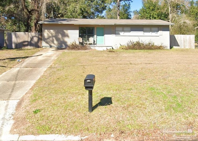 single story home with fence, a front lawn, and driveway