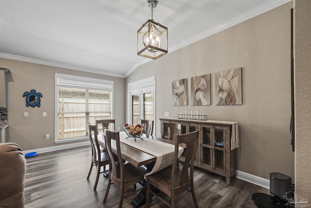 12561 Lillian Hwy, Pensacola, FL 32506 - dining area with ornamental molding, dark wood-style floors, vaulted ceiling, a chandelier, and baseboards
