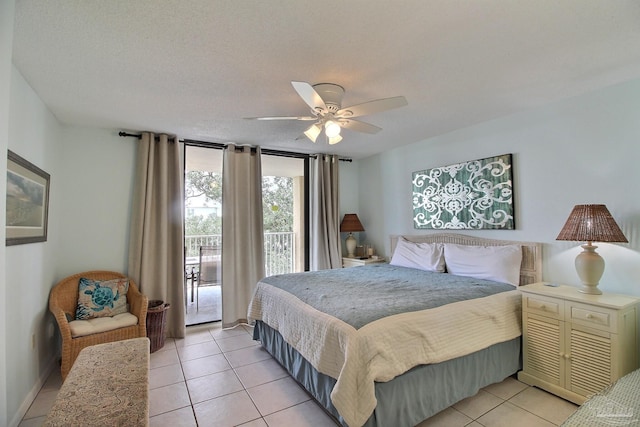 tiled bedroom featuring access to outside, a textured ceiling, and ceiling fan