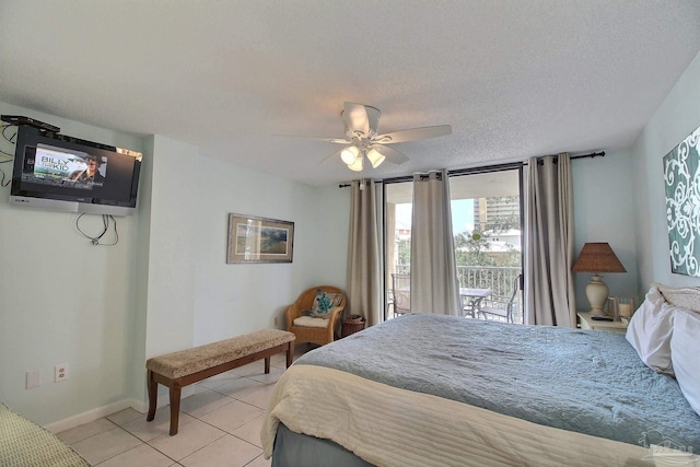 tiled bedroom featuring ceiling fan, access to outside, and a textured ceiling