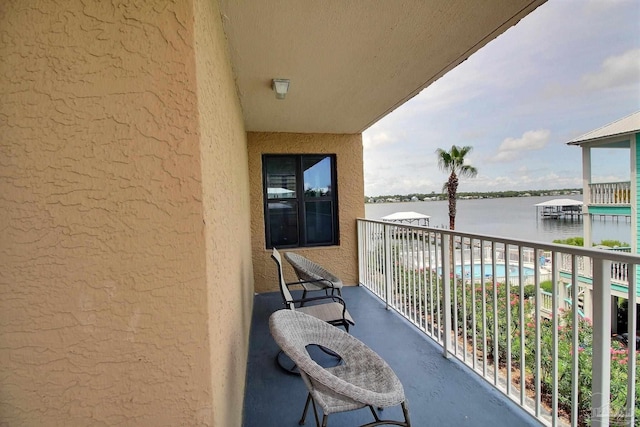 balcony featuring a water view