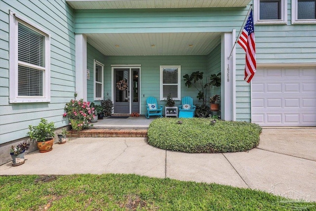 view of exterior entry with covered porch