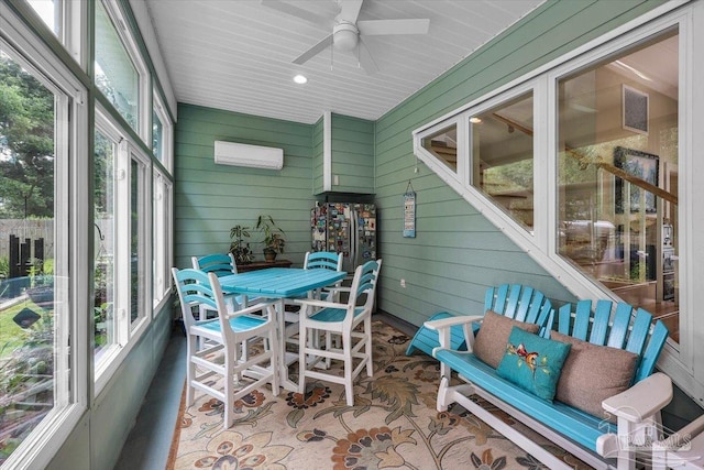 sunroom / solarium featuring ceiling fan and a wall unit AC