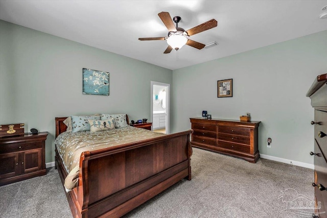 carpeted bedroom with connected bathroom and ceiling fan