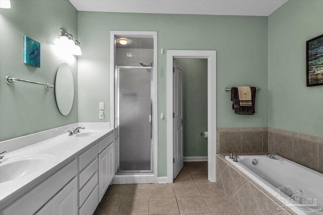 bathroom featuring plus walk in shower, tile patterned flooring, and vanity