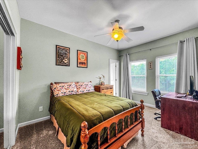 bedroom featuring ceiling fan and carpet