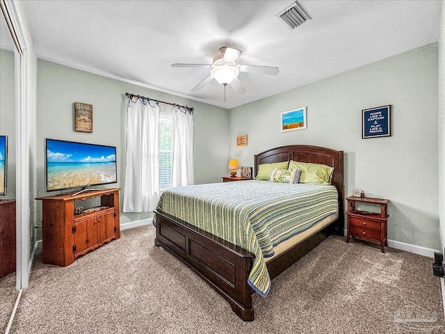 carpeted bedroom with ceiling fan