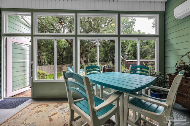 sunroom / solarium featuring a wall mounted AC